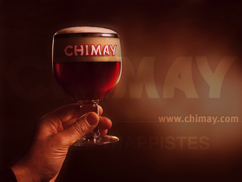 Chimay beer glass held up