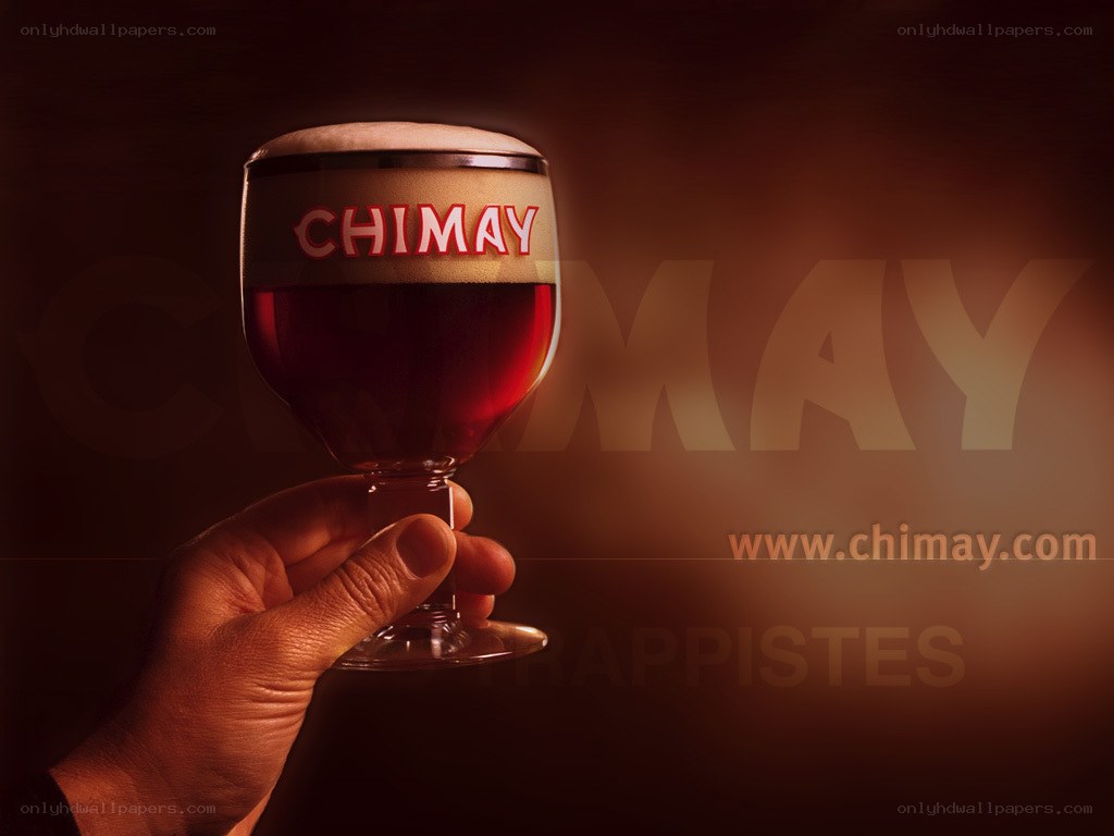 Chimay beer glass held up
