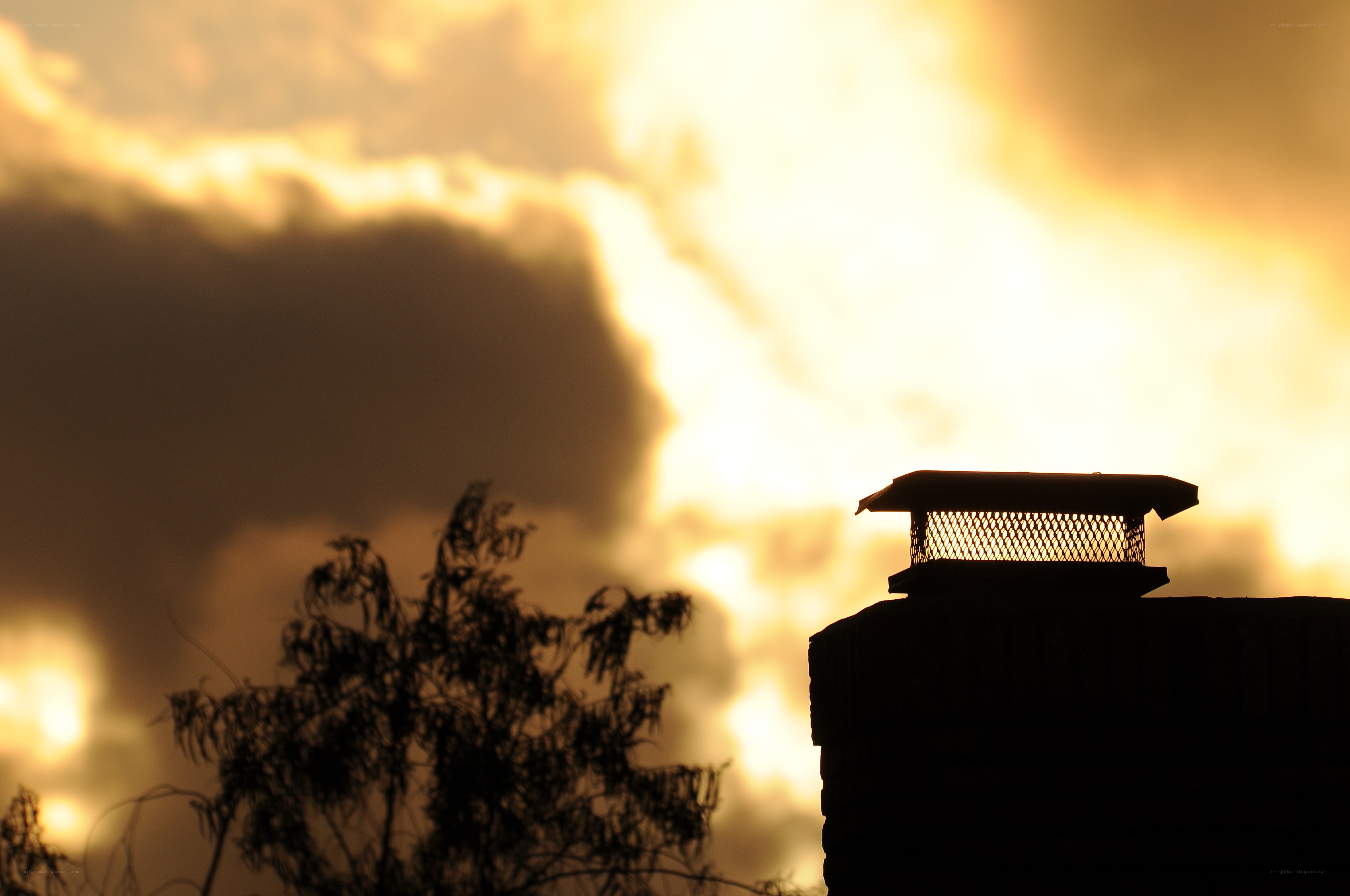 chimney against sunset sky