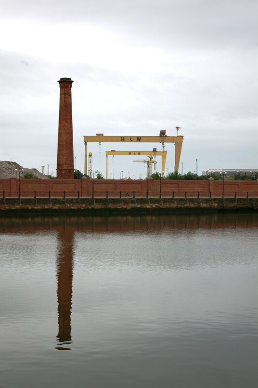 Chimney and cranes at a dock