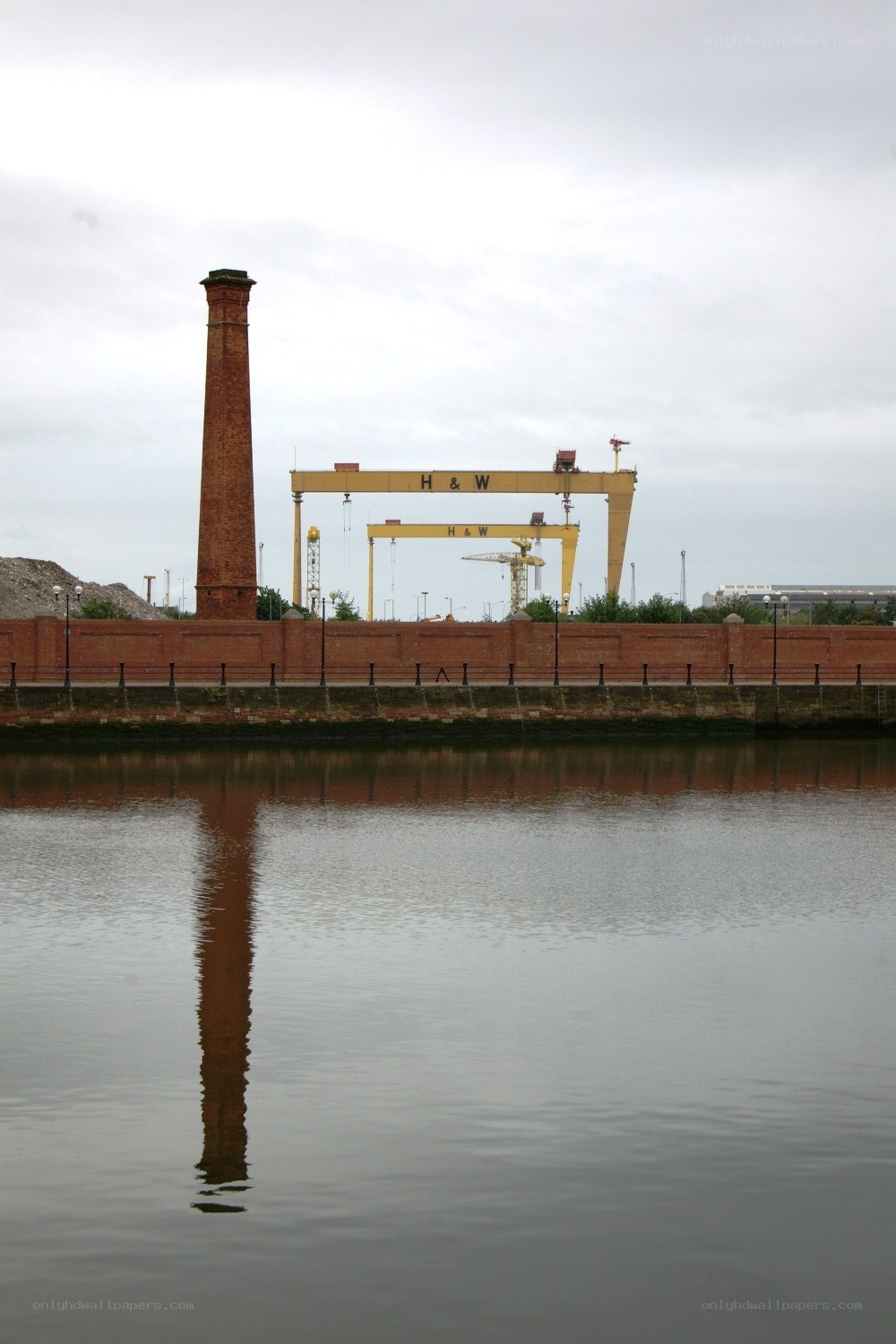 Chimney and cranes at a dock