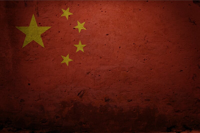 Chinese flag on textured wall