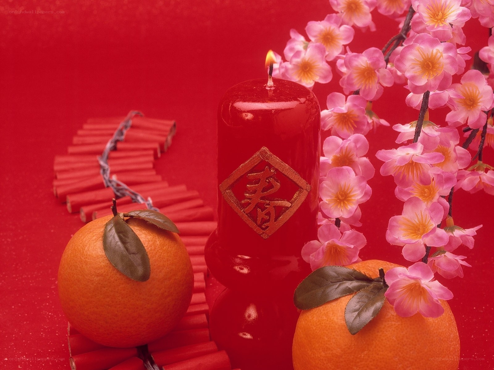 Chinese New Year candle and oranges