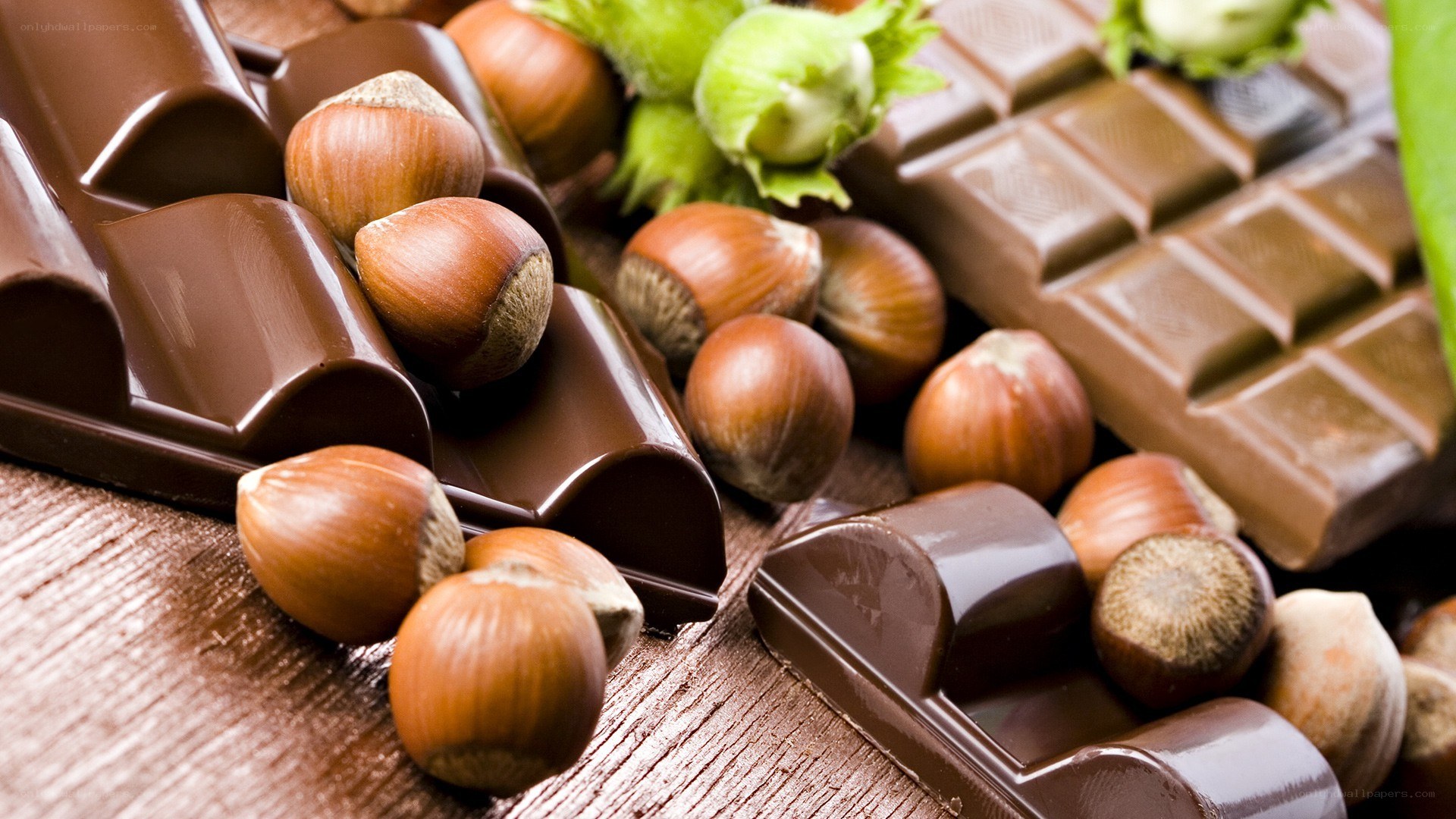 chocolate and hazelnuts on wood