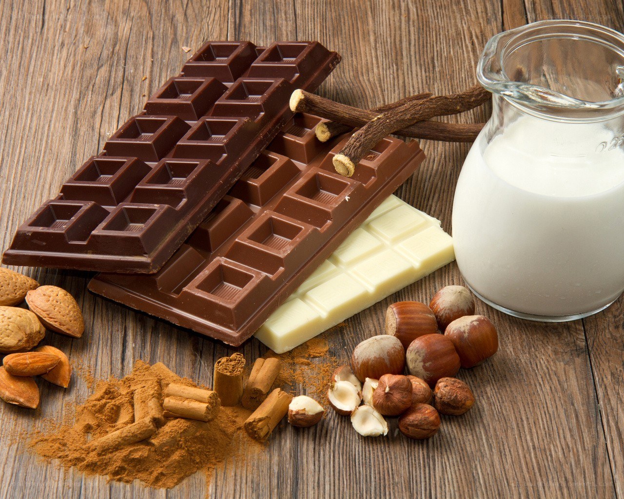 chocolate and nuts on wood