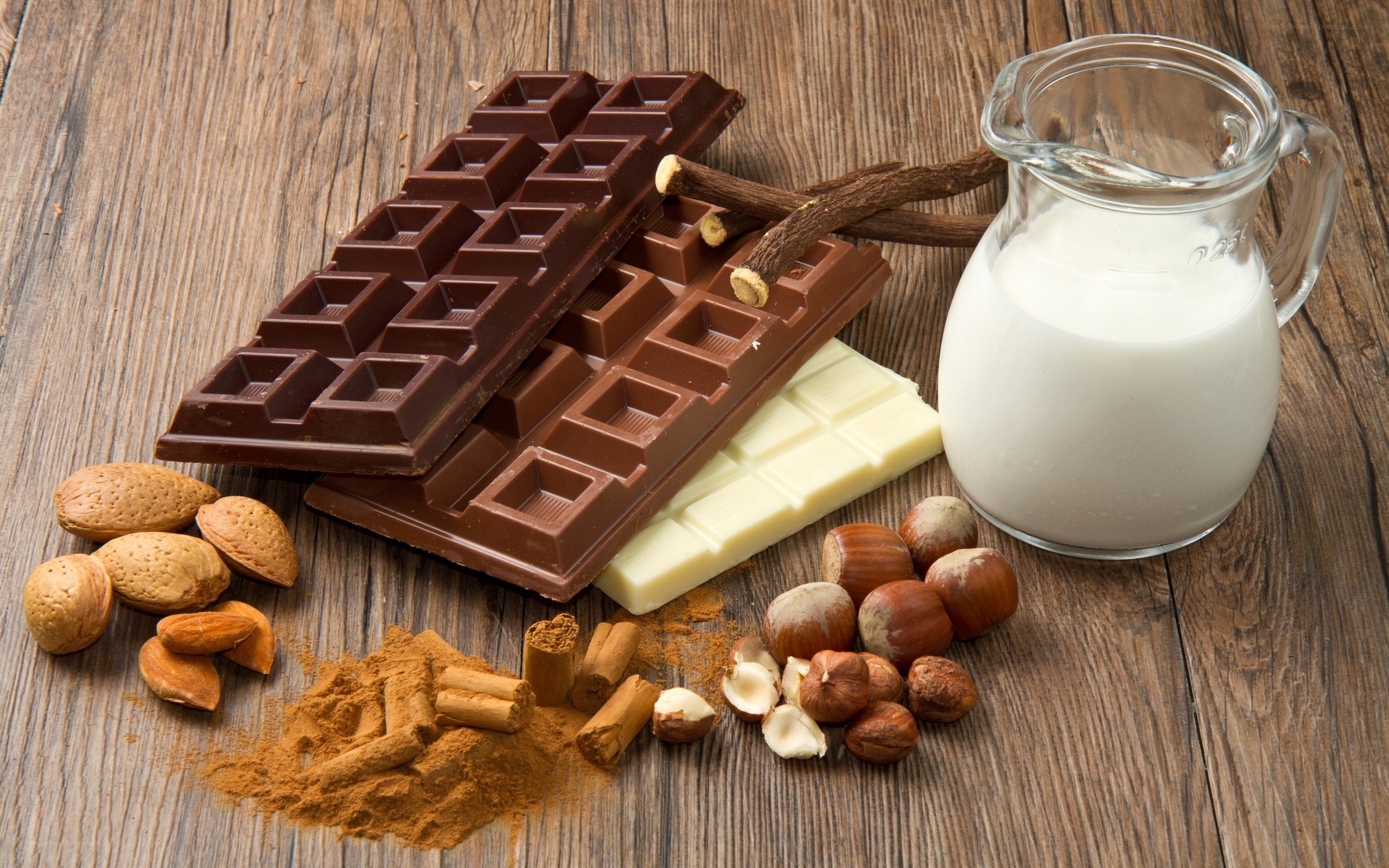chocolate and nuts on wood