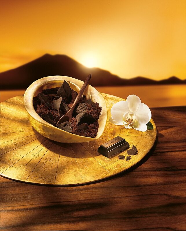 Chocolate and orchid on golden plate