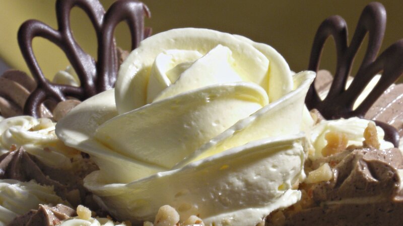 chocolate cake with cream rose