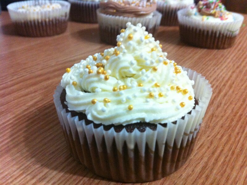 chocolate cupcakes with white frosting
