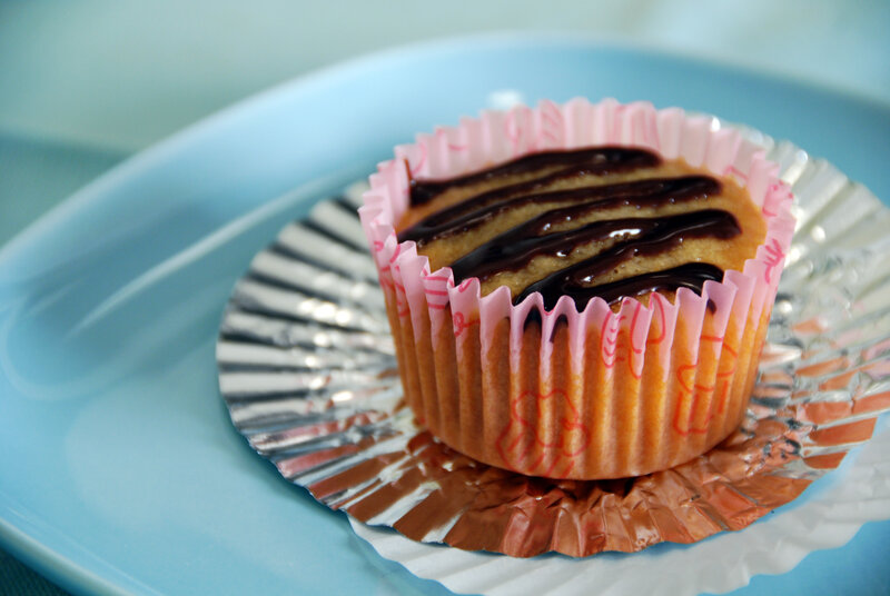 chocolate-drizzled cupcake