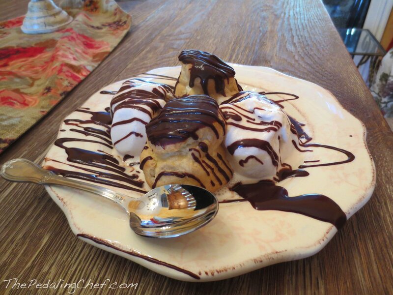 Chocolate-drizzled pastries on a plate