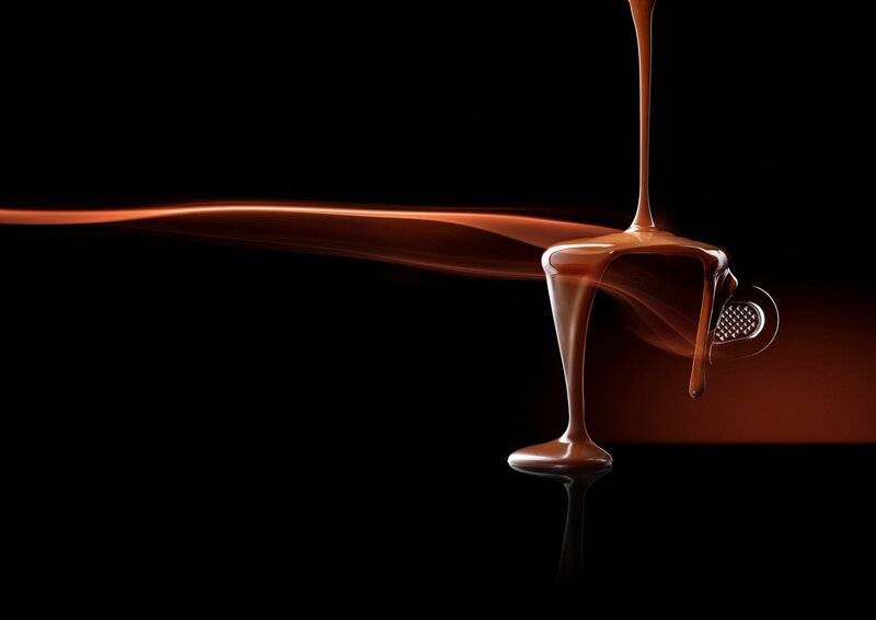 Chocolate pouring into a cup