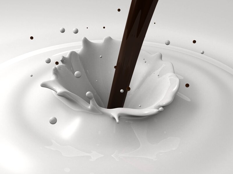 Chocolate pouring into milk