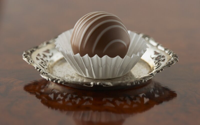 chocolate truffle on silver dish