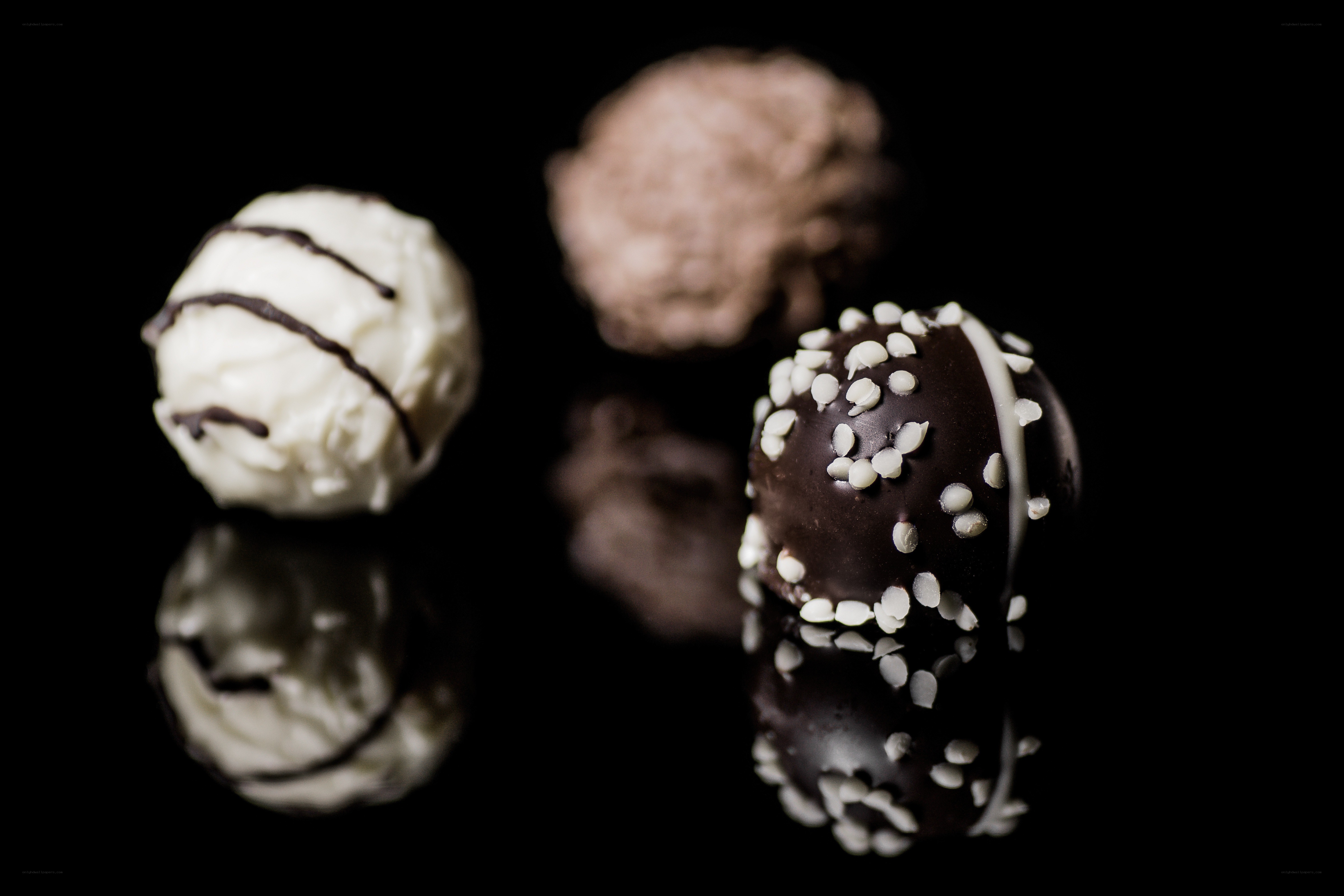 chocolate truffles on black