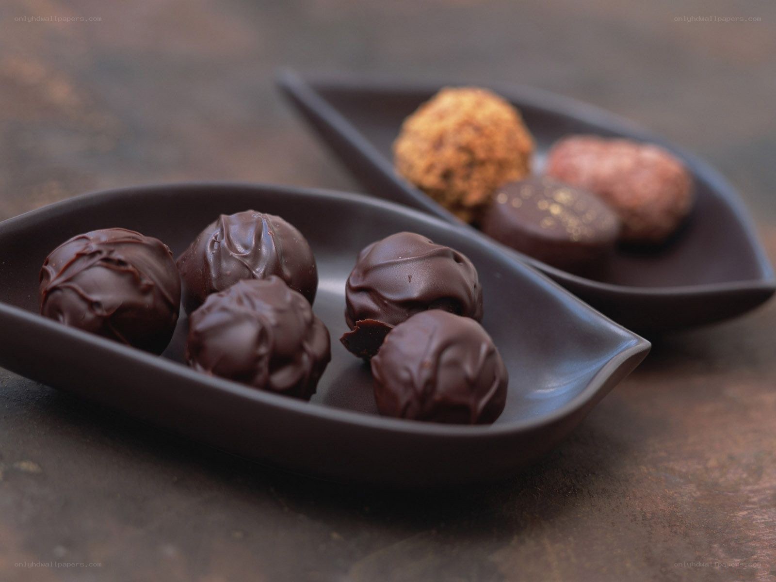 chocolate truffles on dark plates