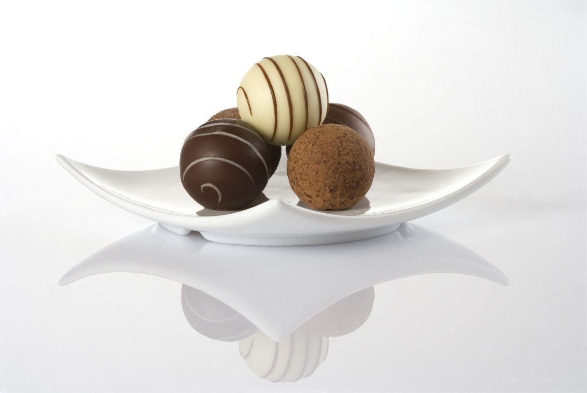 chocolate truffles on white plate