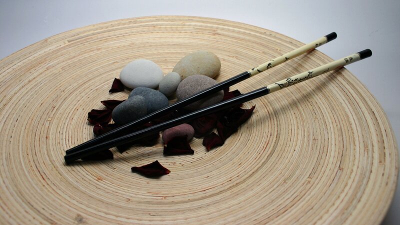 Chopsticks on a wooden plate