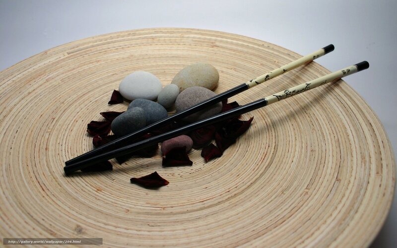 Chopsticks on wooden plate
