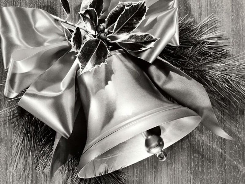 Christmas bells with holly and ribbon