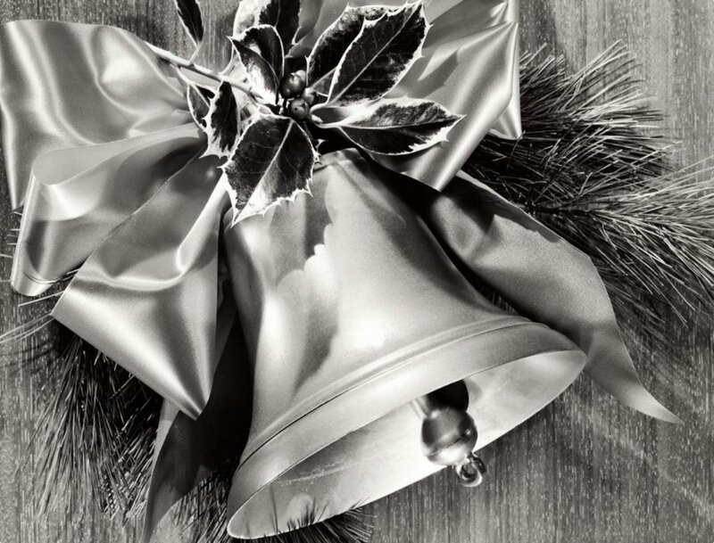 Christmas bells with holly and ribbon