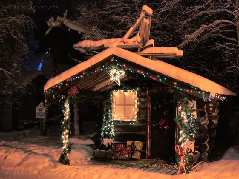 Christmas cabin in snow