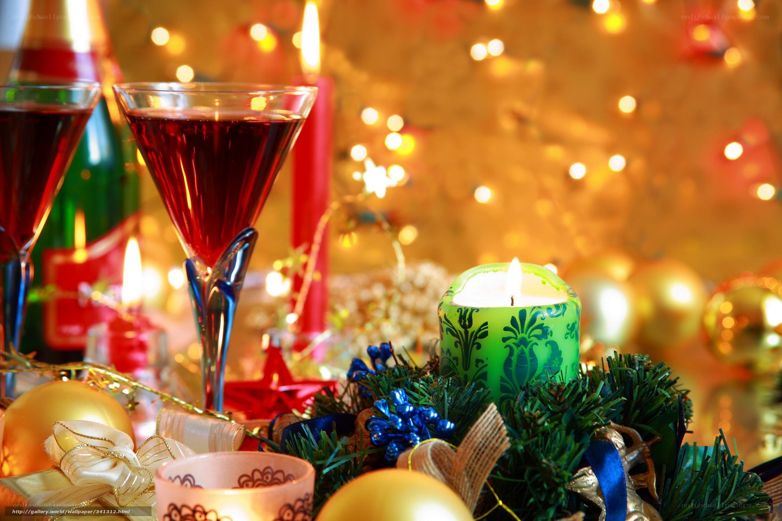 Christmas candle and wine glasses