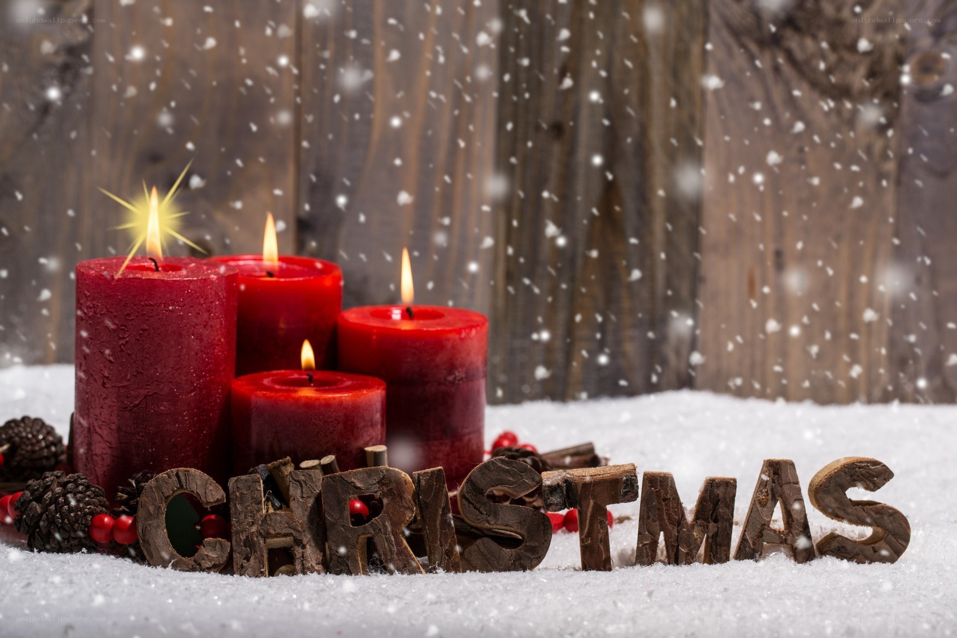 Christmas candles in snow