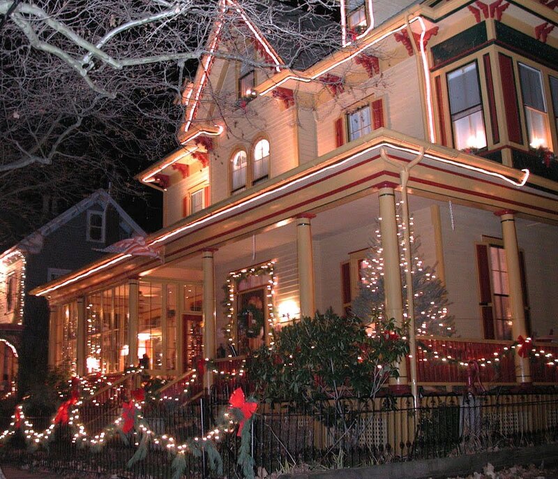 Christmas-decorated house at night