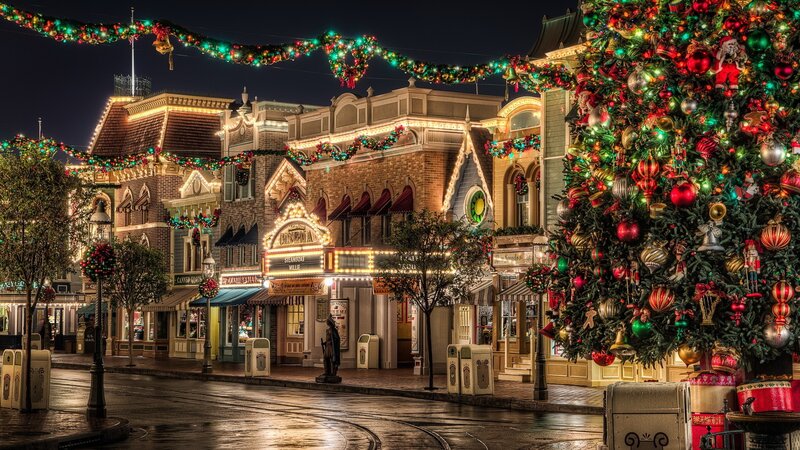 Christmas-decorated street at night