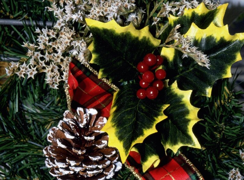 Christmas decoration with holly and pinecone