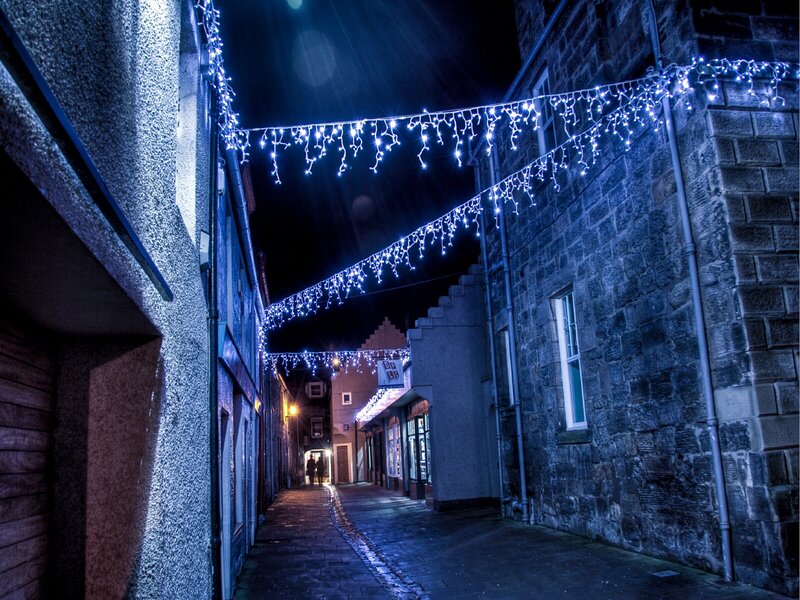 Christmas lights in a narrow alley
