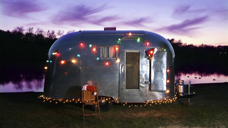 Christmas lights on a vintage trailer