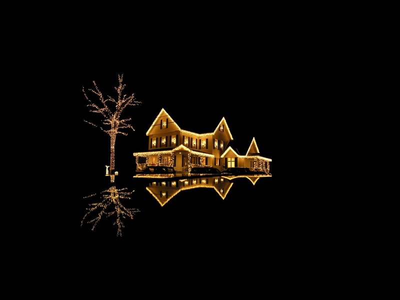 Christmas lights on house at night