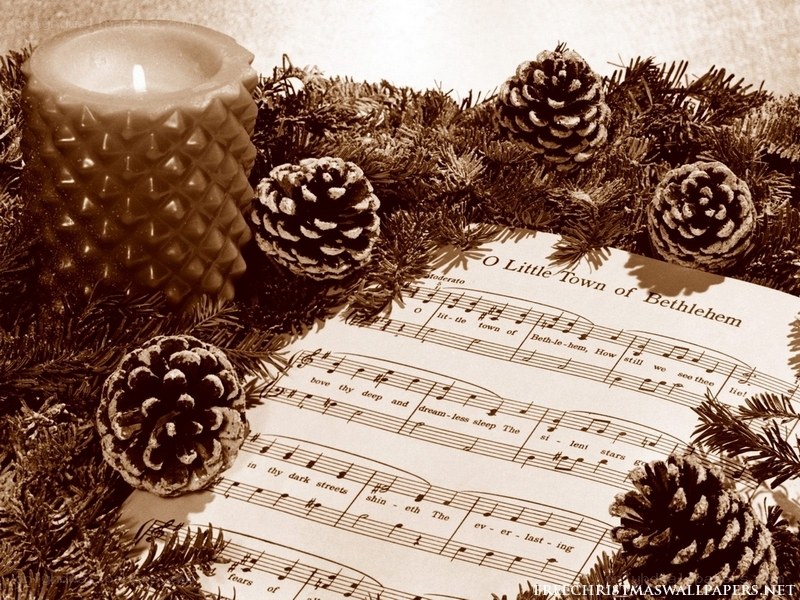 Christmas music sheet with pinecones
