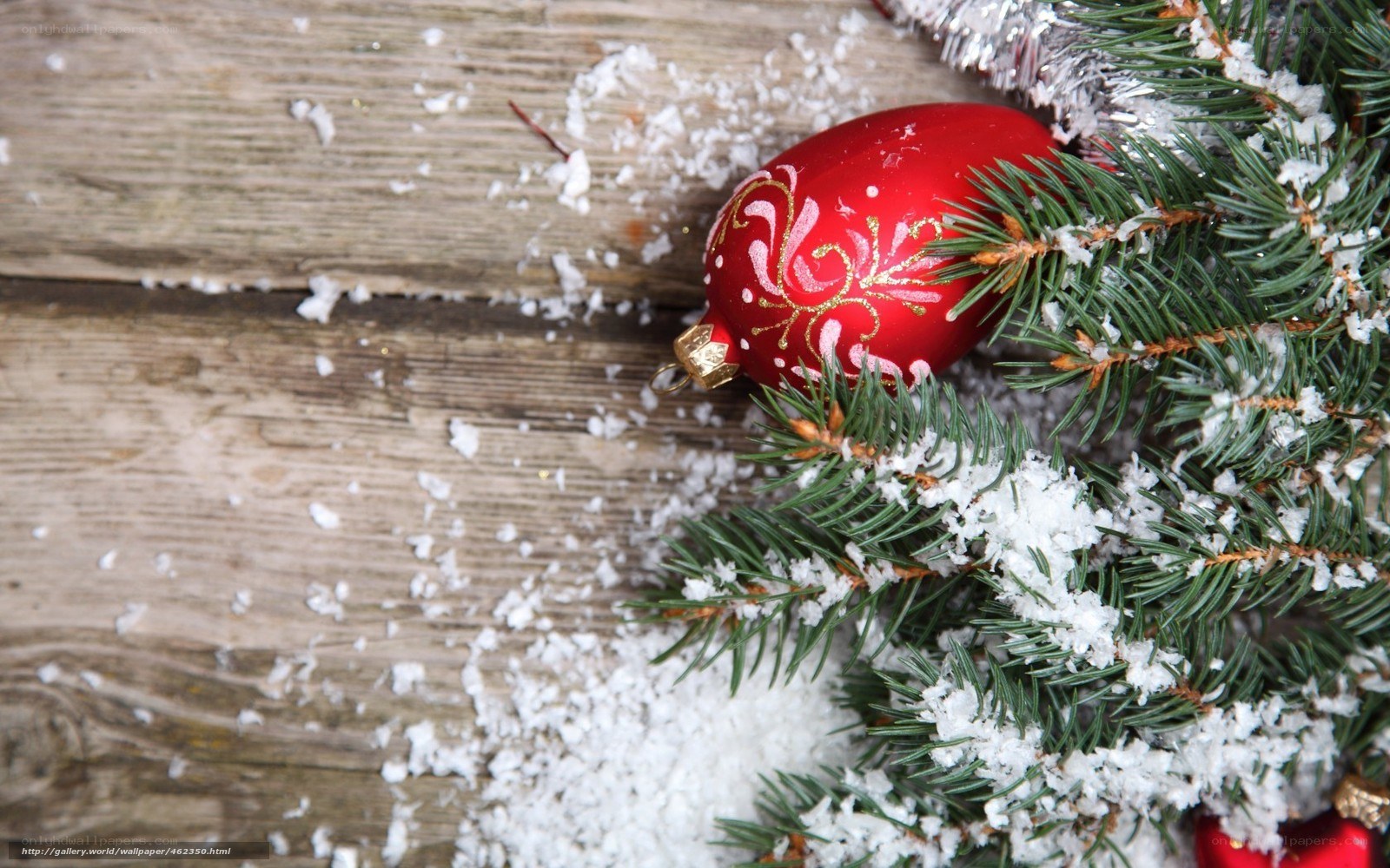 Christmas ornament on snowy wood