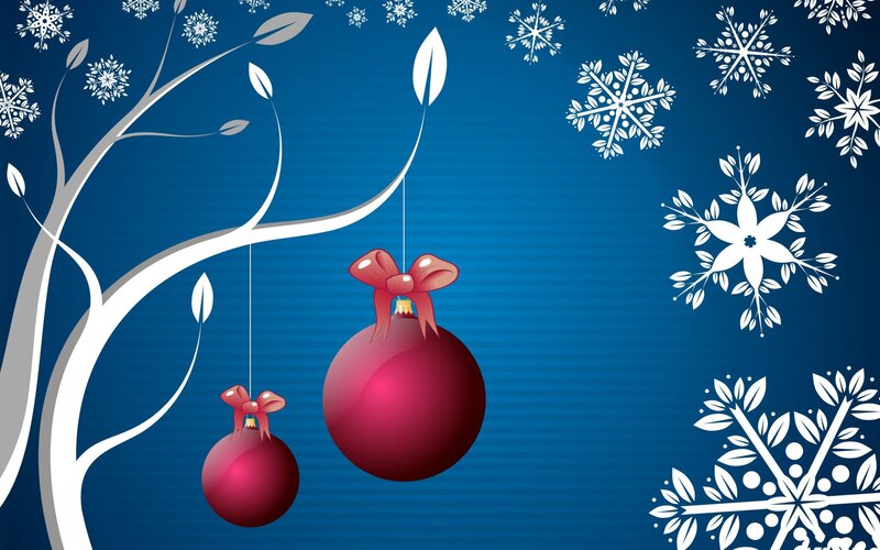 Christmas ornaments on a snowy tree