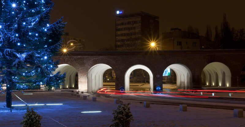 Christmas tree by arch bridge