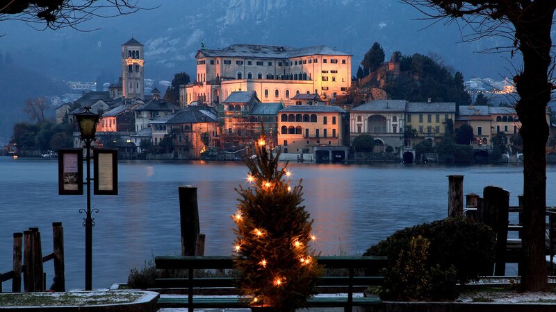 Christmas tree by the lake at dusk