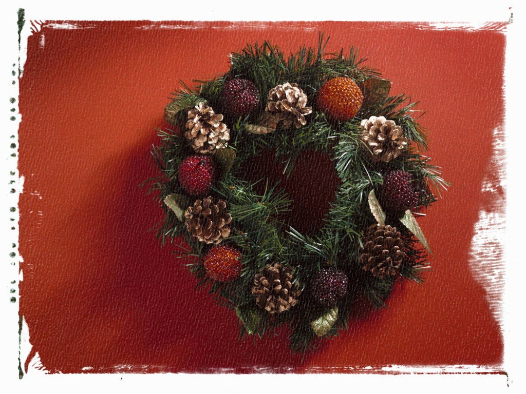 Christmas wreath on red background