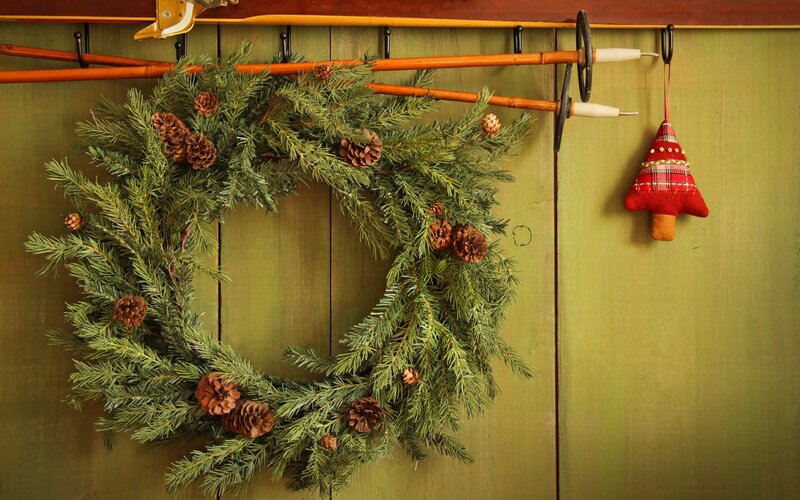 Christmas wreath on wooden wall
