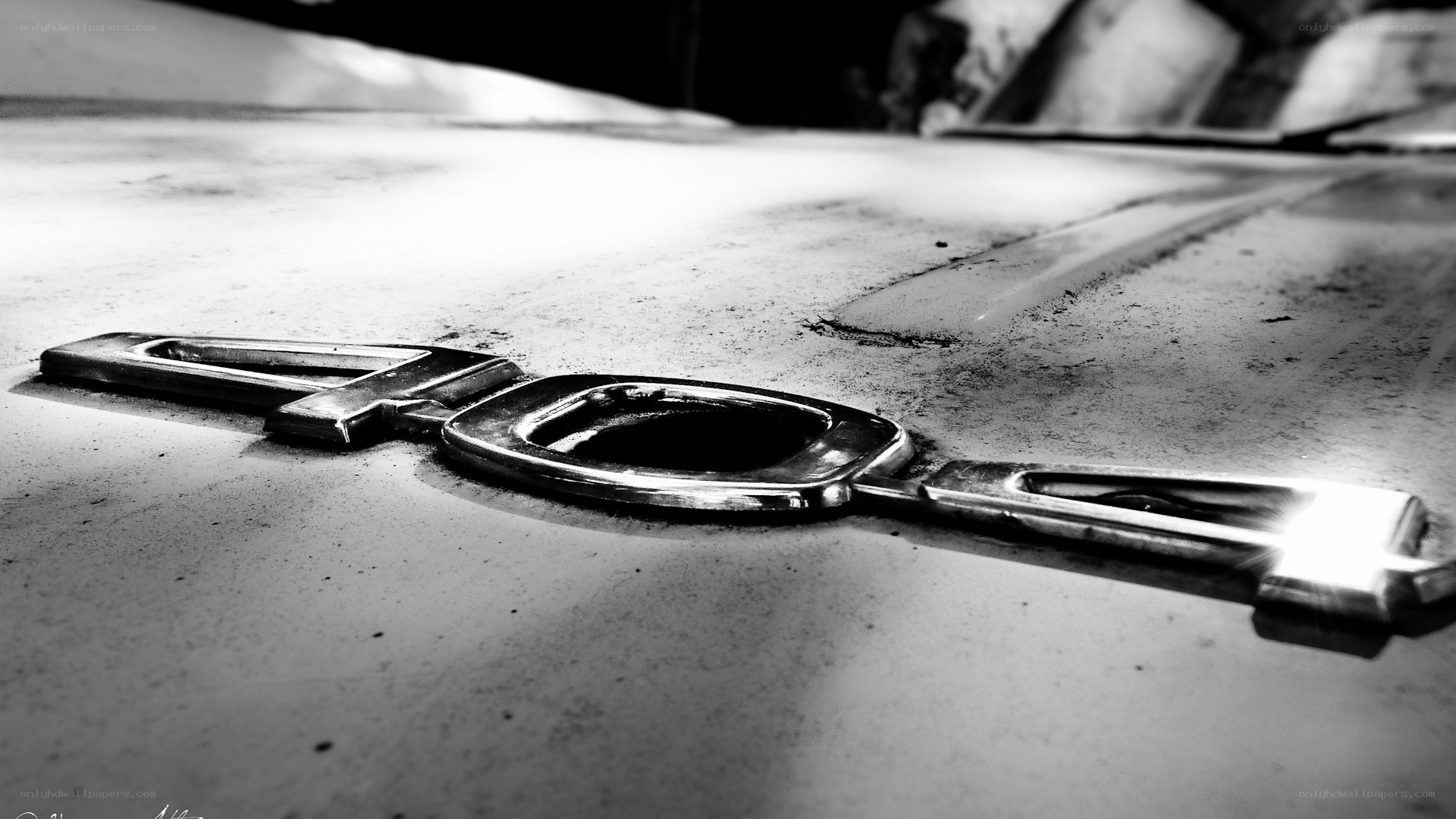 Chrome '40' emblem on car hood