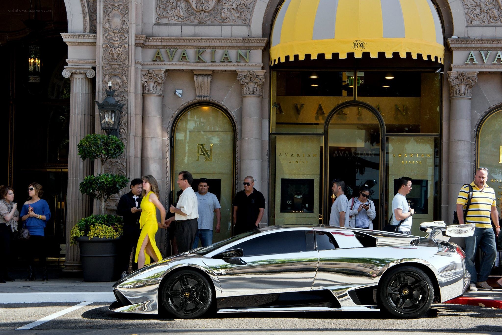 Chrome car outside luxury store