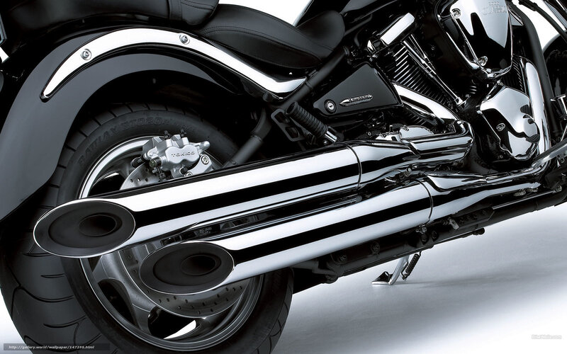 Chrome exhaust on black motorcycle