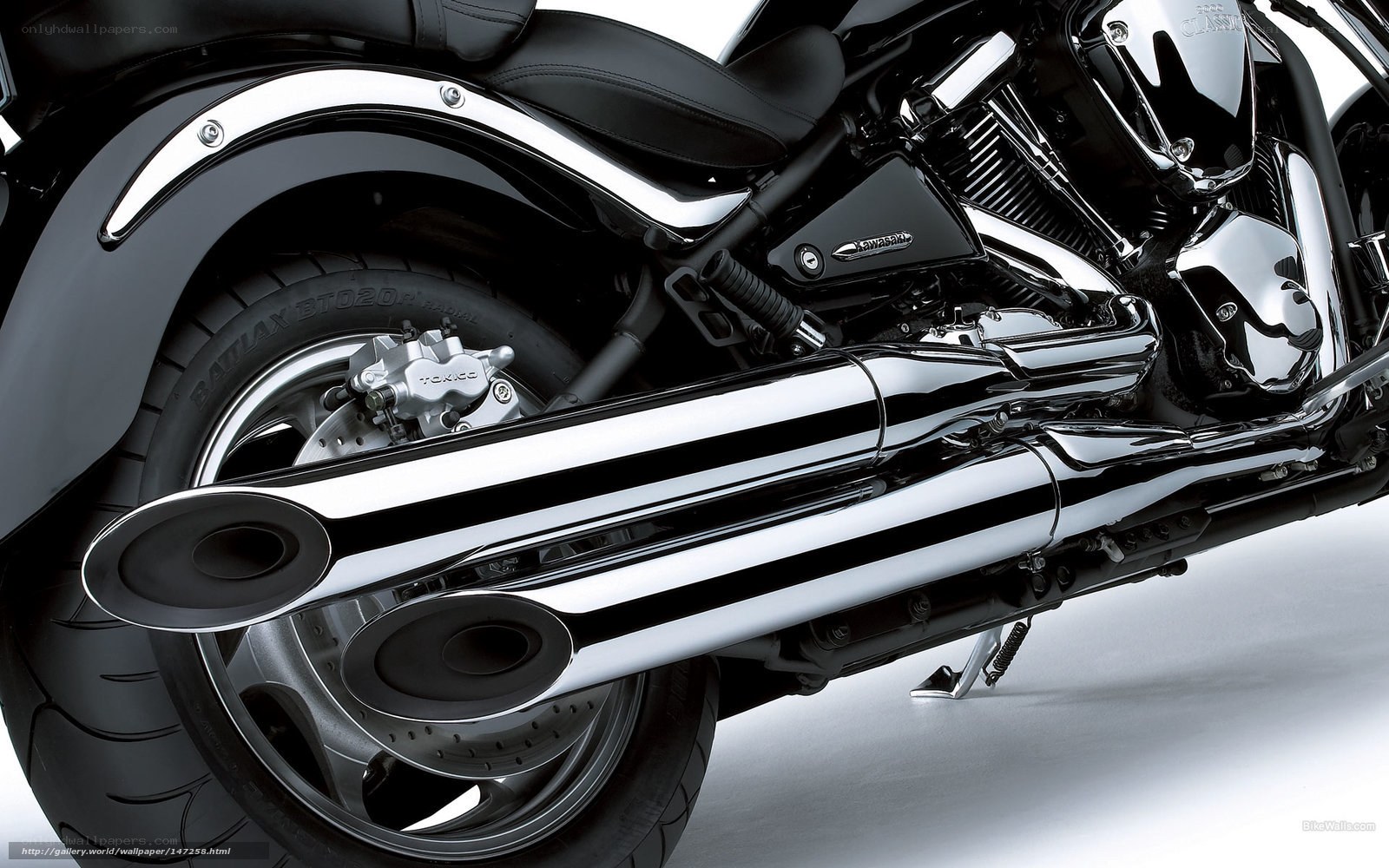Chrome exhaust on black motorcycle