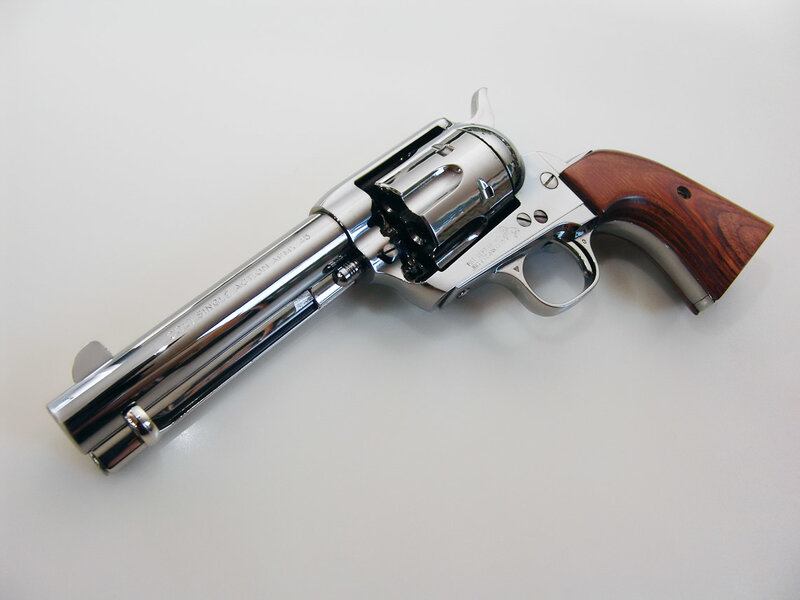 chrome revolver with wood grip