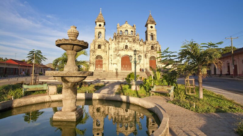 Church and fountain in a town square