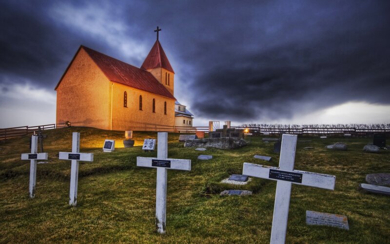 Church at dusk with cemetery