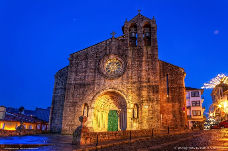 Church at dusk with illuminated facade