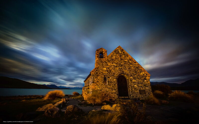 Church at night by a lake
